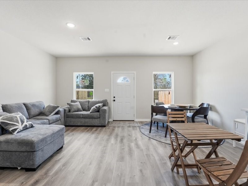 8708 Wileyvale Road Houston, TX 77016 - Photo 11 of 23 a living room with furniture and a wooden floor