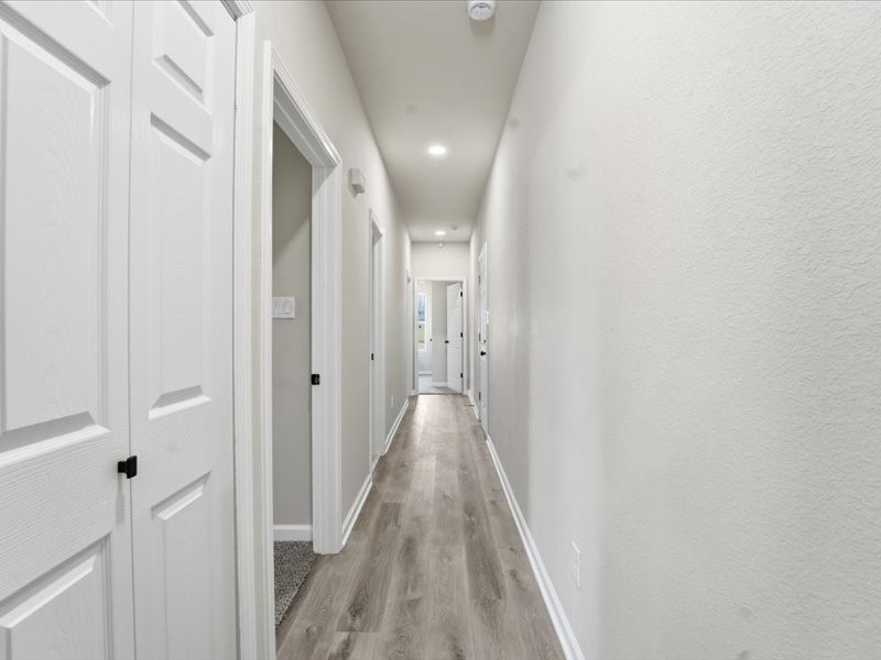 8708 Wileyvale Road Houston, TX 77016 - Photo 12 of 23 a view of a hallway with wooden floor
