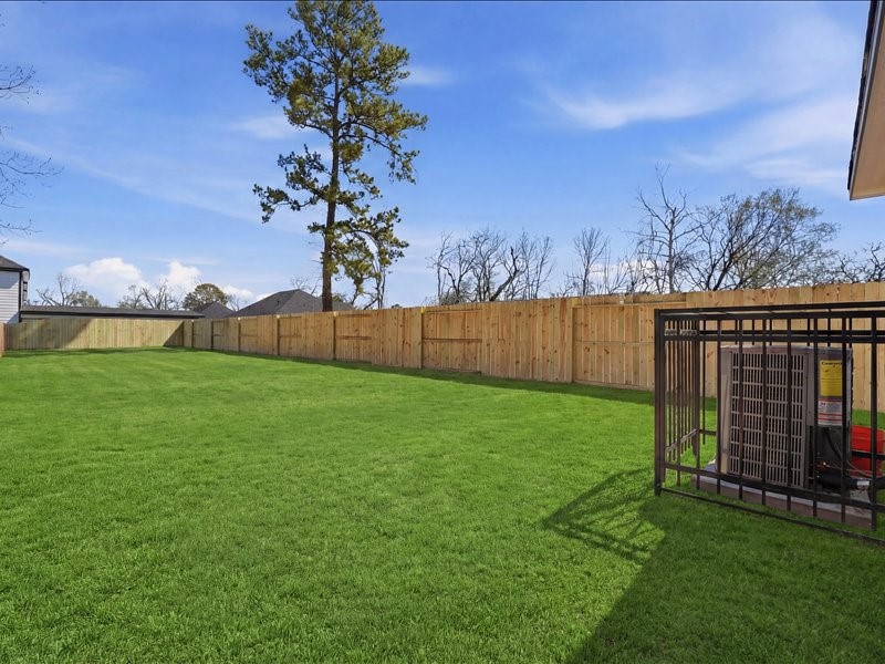 8708 Wileyvale Road Houston, TX 77016 - Photo 21 of 23 a view of yard with swimming pool and green space