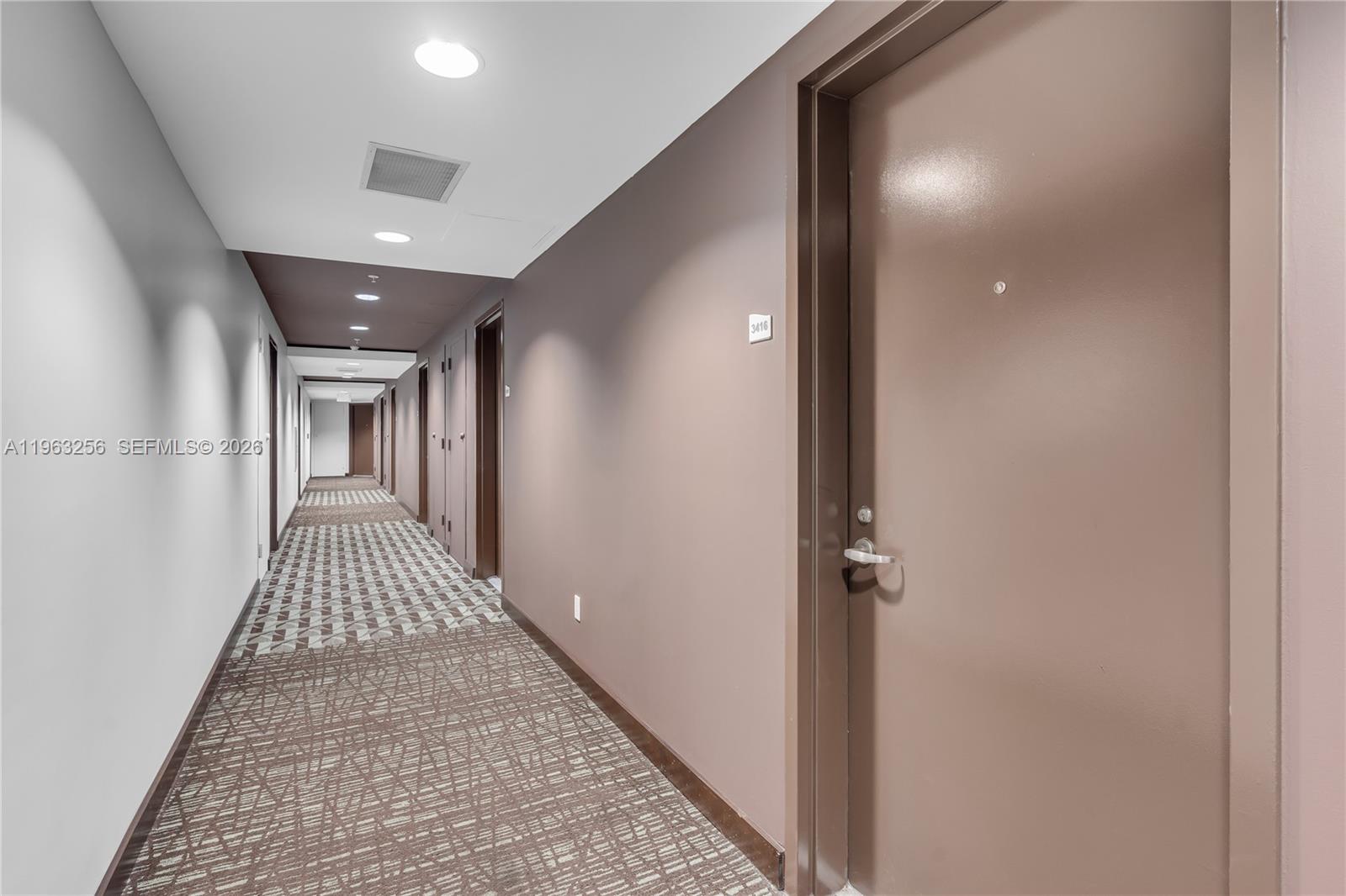 60 Southwest 13th Street, Unit 3416 Miami, FL 33130 - Photo 6 of 20 a view of hallway with wooden floor
