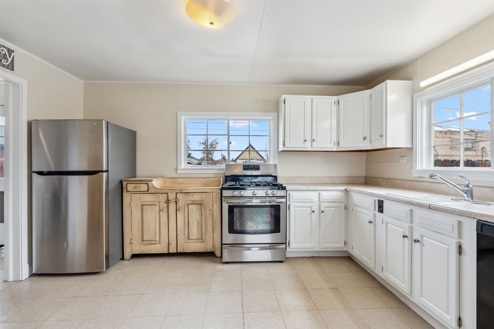 532 Front Street Fairplay, CO 80440 - Photo 11 of 46 a kitchen with stainless steel appliances granite countertop a refrigerator and a stove