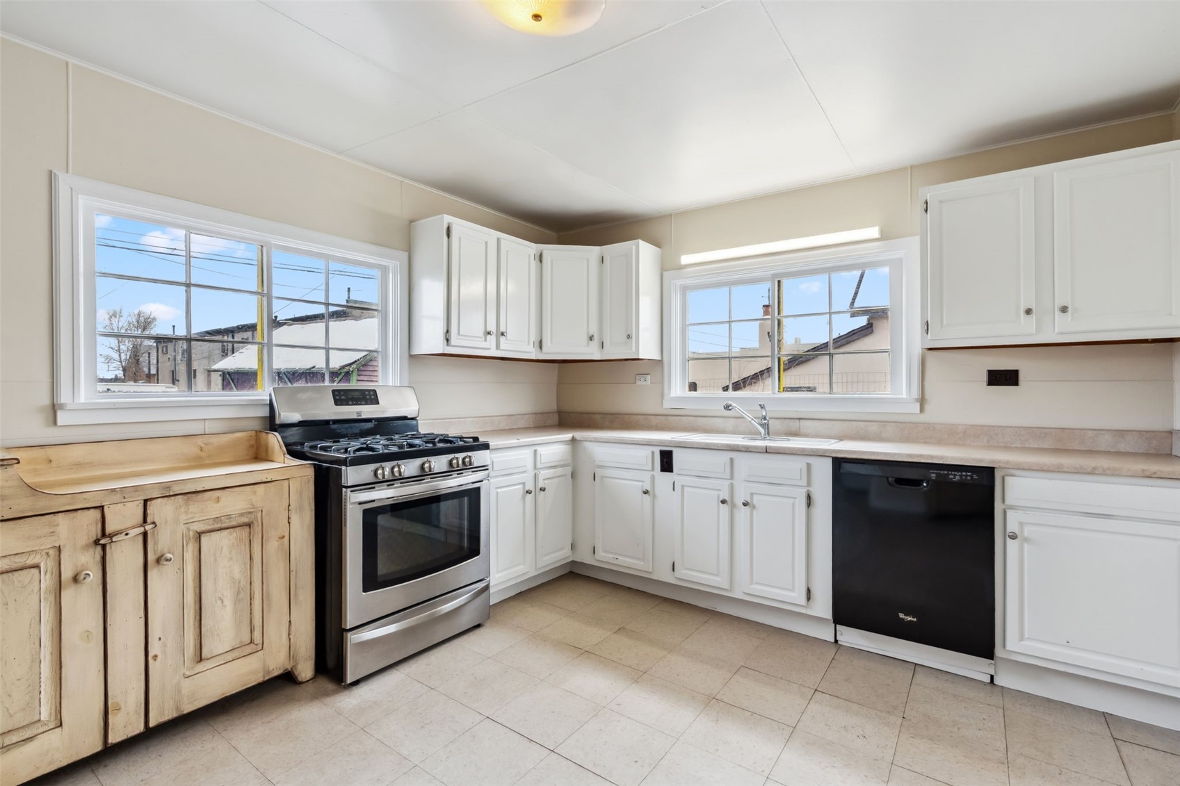 532 Front Street Fairplay, CO 80440 - Photo 12 of 46 a kitchen with granite countertop white cabinets and white appliances