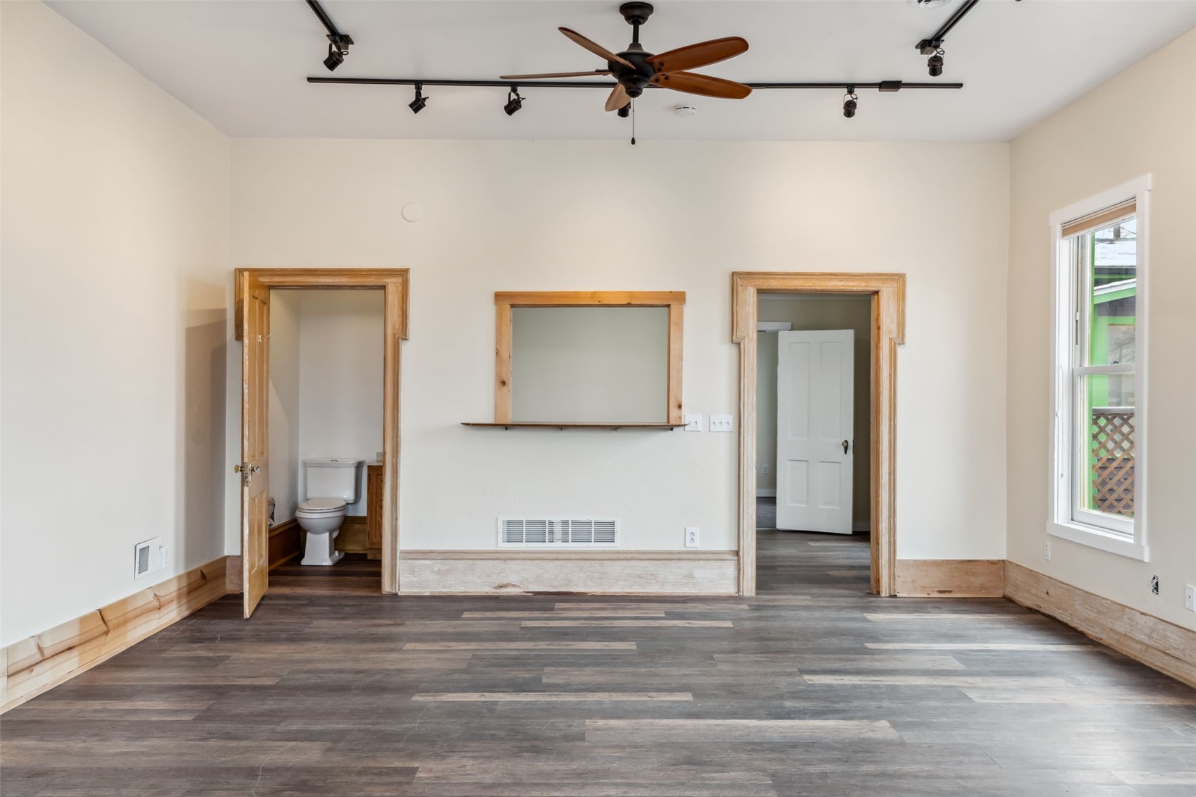 532 Front Street Fairplay, CO 80440 - Photo 36 of 46 a view of a livingroom with wooden floor and a ceiling fan