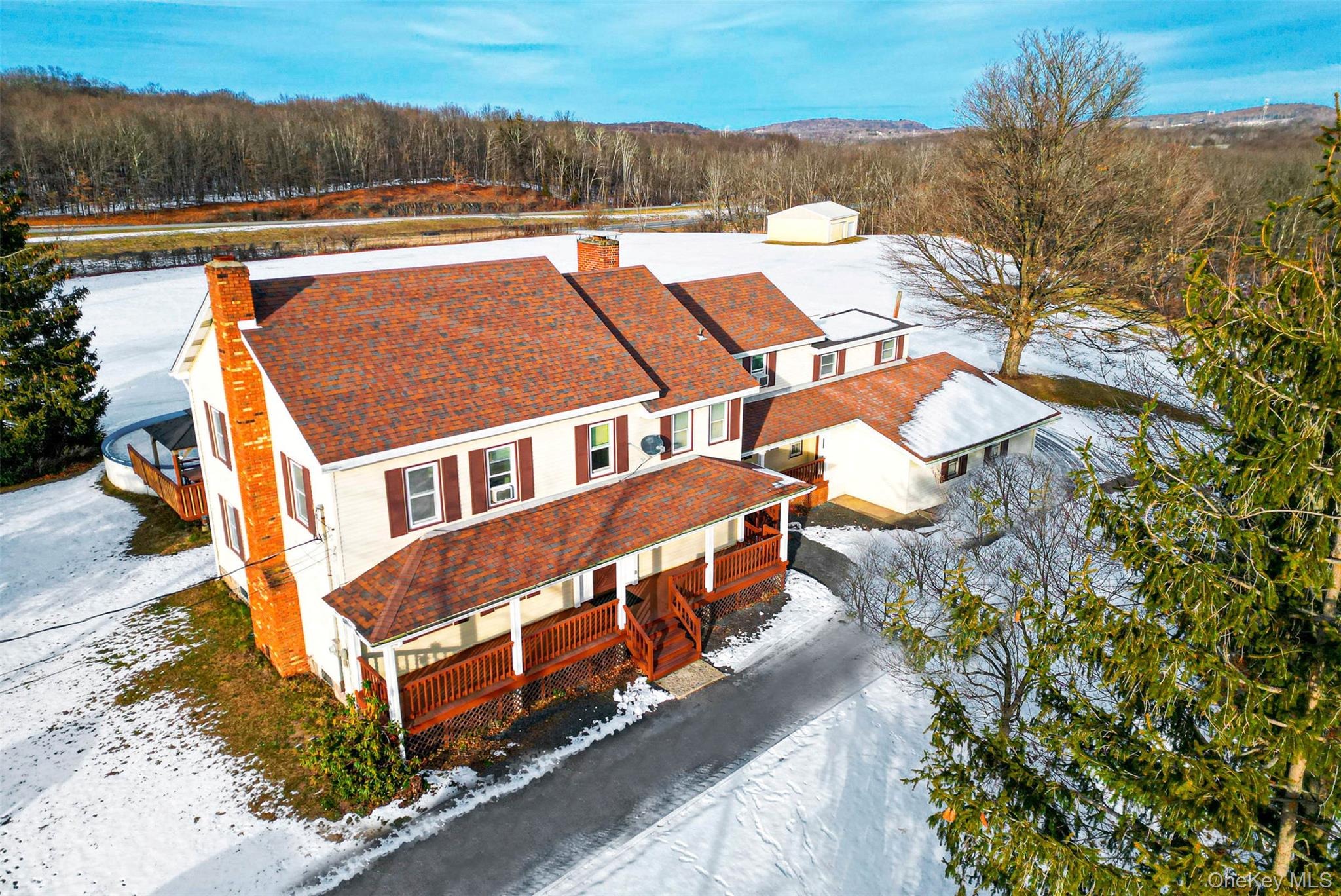 a view of a house with pool and yard