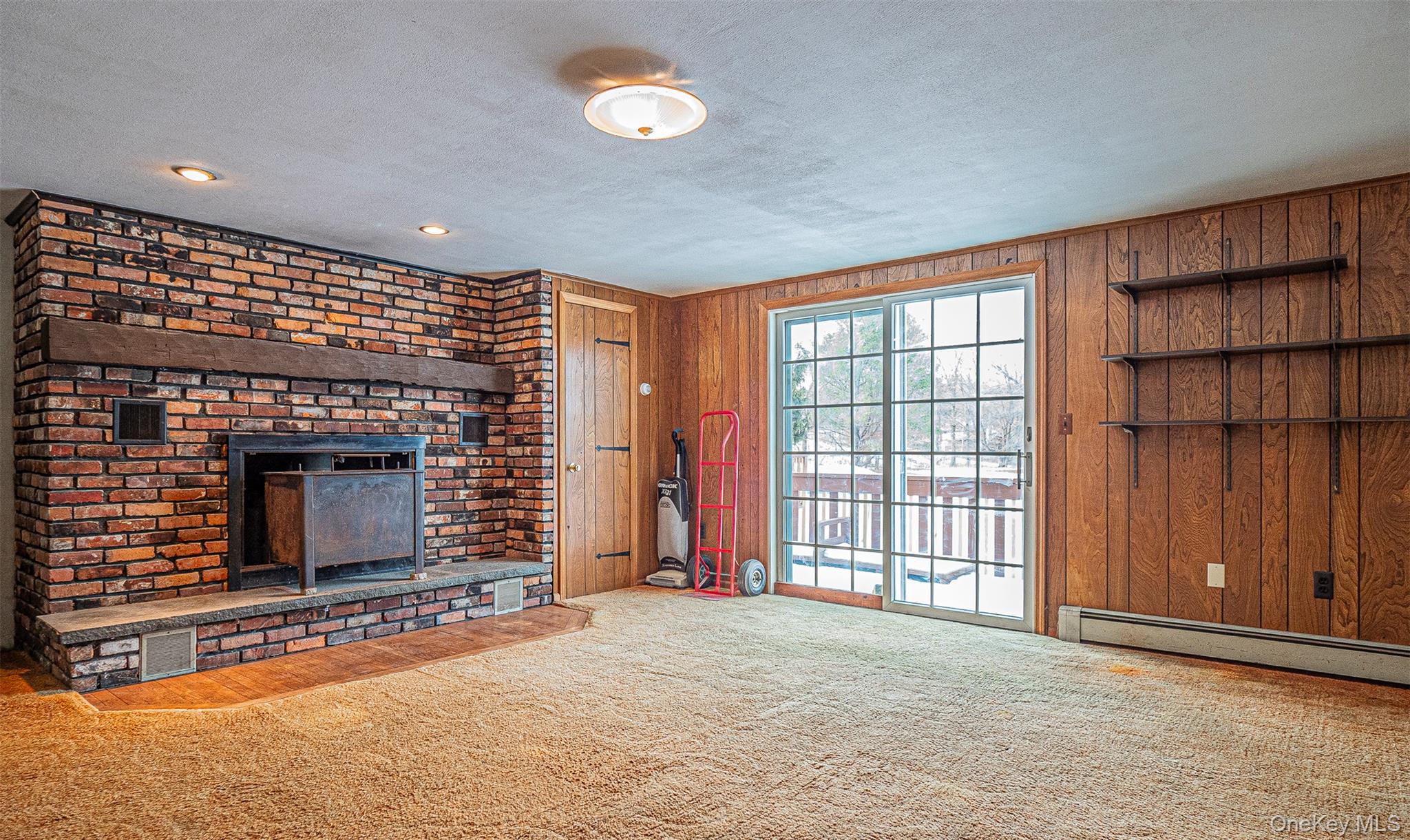 238 South Centerville Road Middletown, NY 10940 - Photo 11 of 28 a view of an empty room with a fireplace and a window