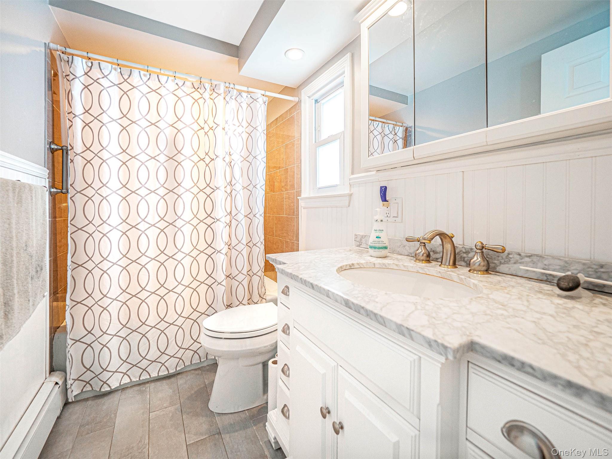 238 South Centerville Road Middletown, NY 10940 - Photo 16 of 28 a bathroom with a granite countertop sink a toilet and a mirror