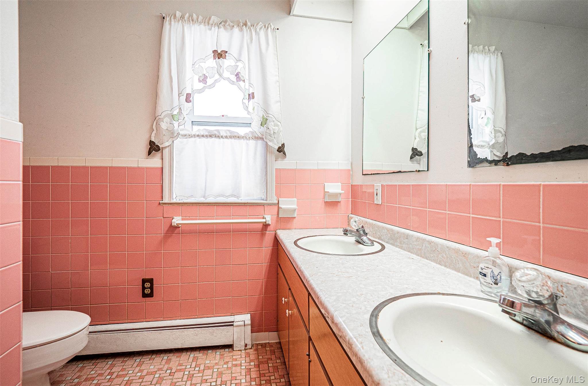 238 South Centerville Road Middletown, NY 10940 - Photo 22 of 28 a bathroom with a sink a toilet and mirror