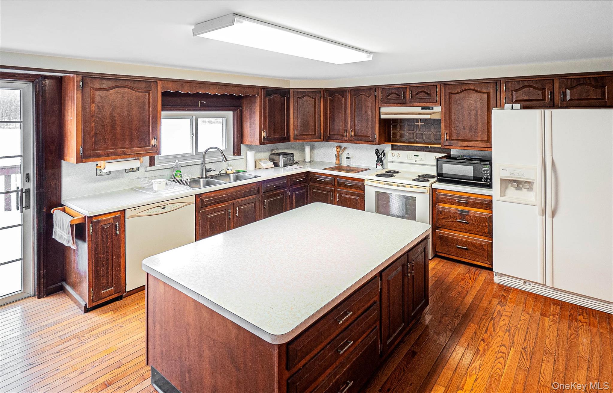 238 South Centerville Road Middletown, NY 10940 - Photo 8 of 28 a kitchen with a stove top oven a sink dishwasher and a refrigerator