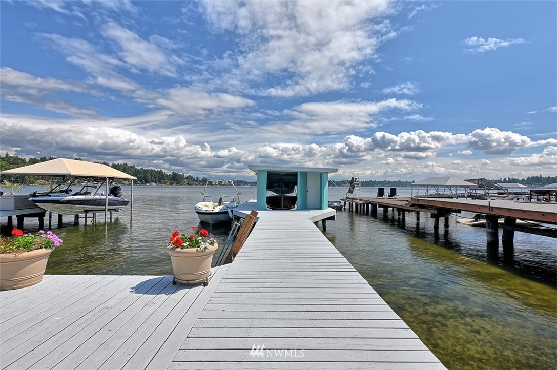 2017 Vernon Road Lake Stevens, WA 98258 - Photo 1 of 25 a view of a rooftop deck with dining table and chairs