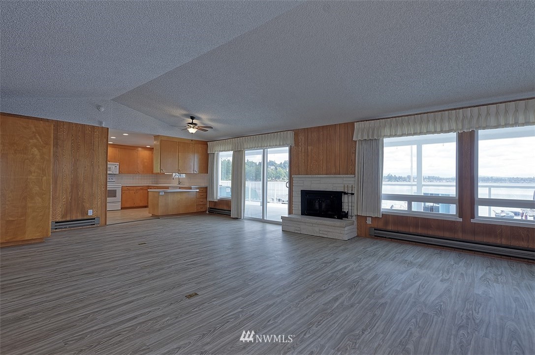 2017 Vernon Road Lake Stevens, WA 98258 - Photo 11 of 25 a view of empty room with a fireplace and wooden floor