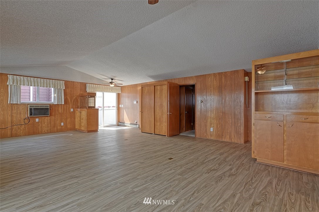 2017 Vernon Road Lake Stevens, WA 98258 - Photo 13 of 25 a view of an empty room with wooden floor and windows