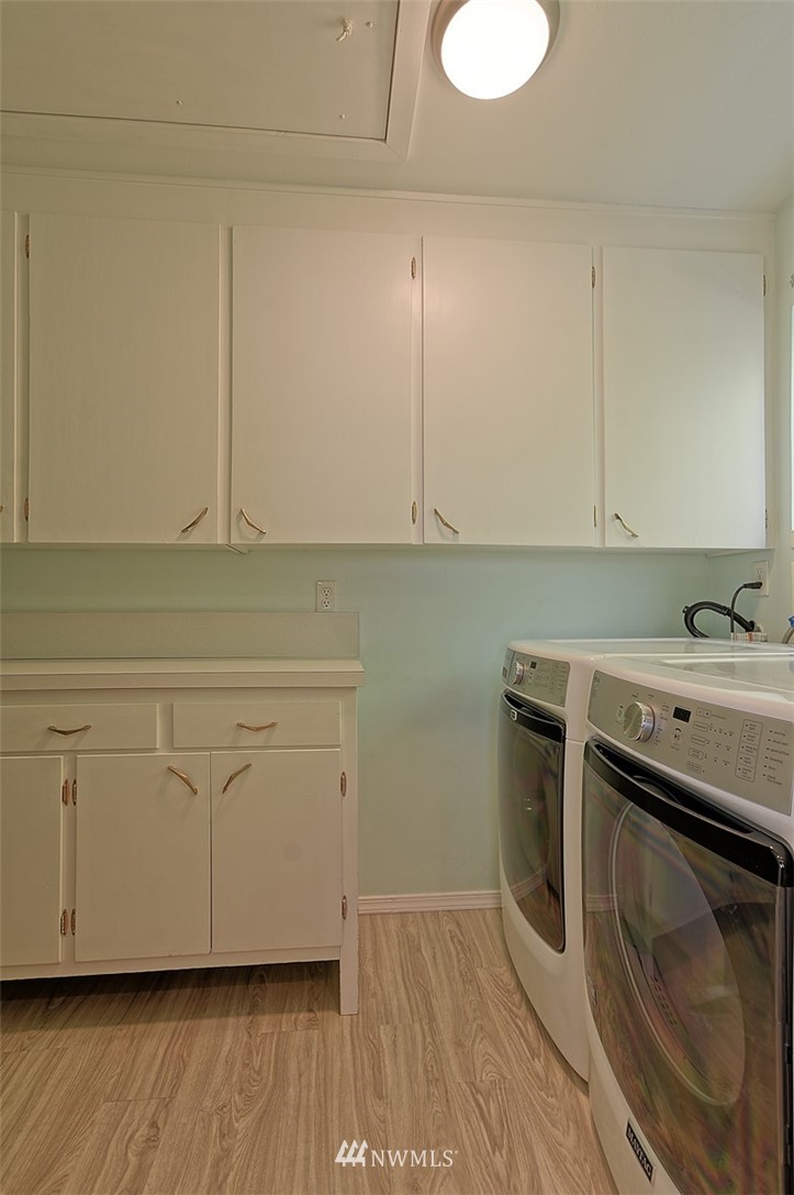 2017 Vernon Road Lake Stevens, WA 98258 - Photo 23 of 25 a room with cabinets and a wooden floor