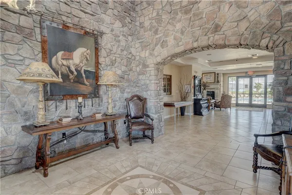 a lobby with furniture and wooden floor