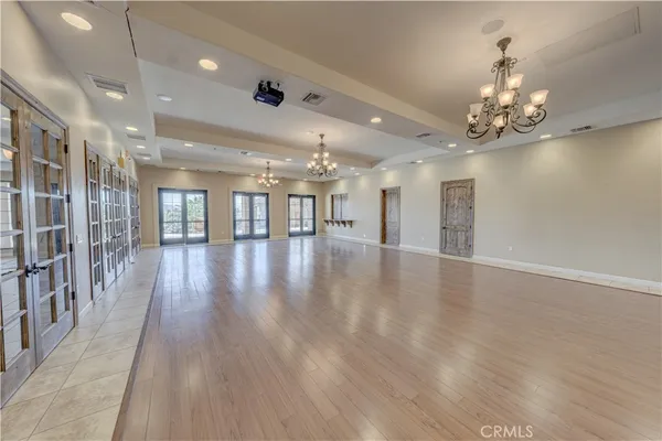 a view of a room with wooden floor