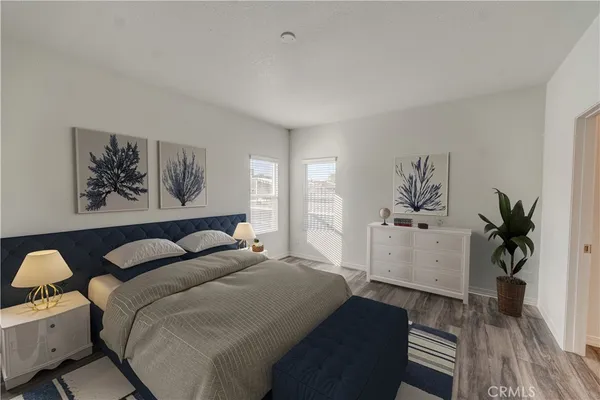 a bedroom with a bed and a desk