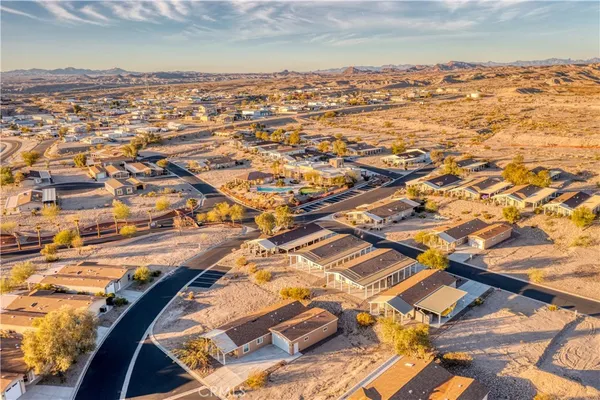 an aerial view of residential building and ocean