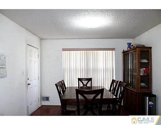 2 Inverness Drive Edison, NJ 08820 - Photo 4 of 14 a view of a dining room with furniture and window