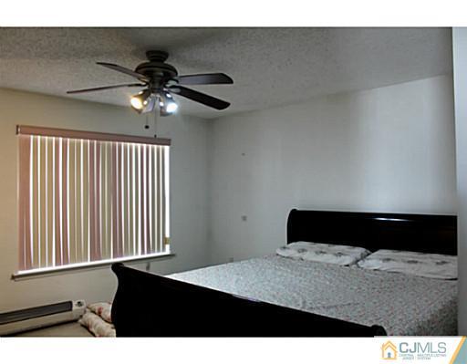 2 Inverness Drive Edison, NJ 08820 - Photo 5 of 14 a black and white wall with a large window