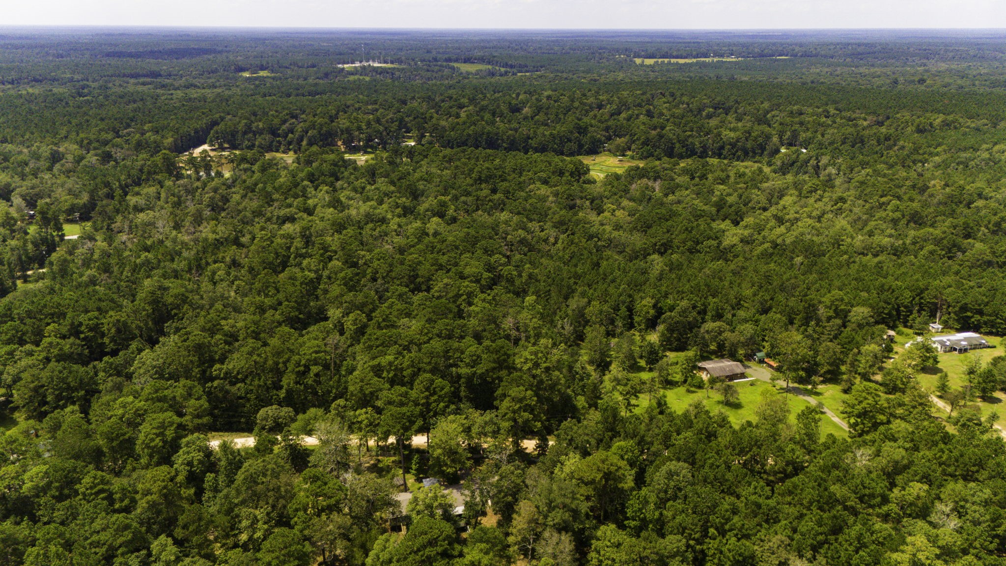 271 Ivanhoe Ranchettes Drive Ivanhoe, TX 75979 - Photo 8 of 40 an aerial view of residential houses with outdoor space and trees