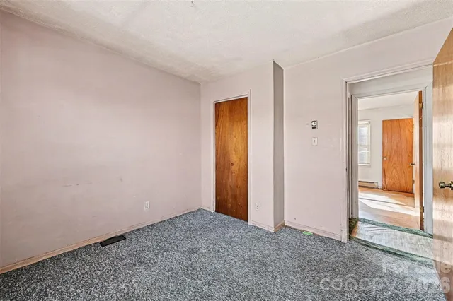 a backyard of a house with large trees