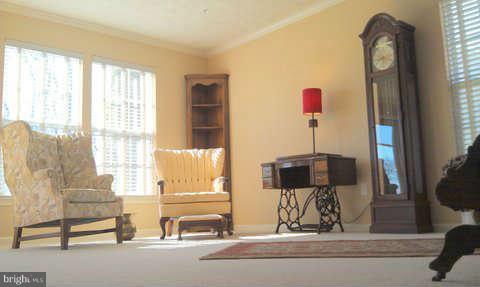 2413 High Brandy Way Odenton, MD 21113 - Photo 3 of 6 a living room with a fireplace furniture and a flat screen tv