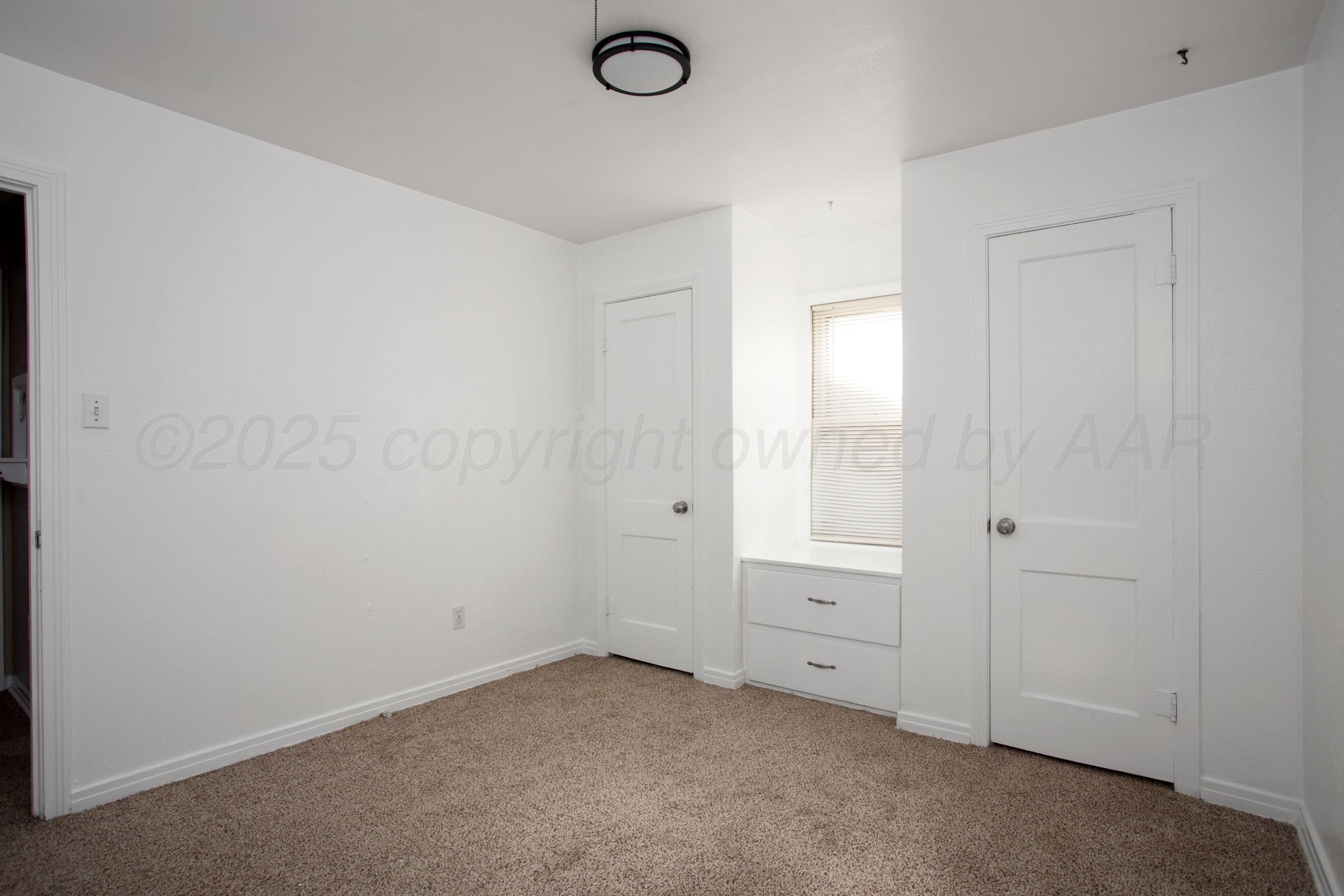 4215 South Travis Street Amarillo, TX 79110 - Photo 15 of 20 a view of an empty room and window