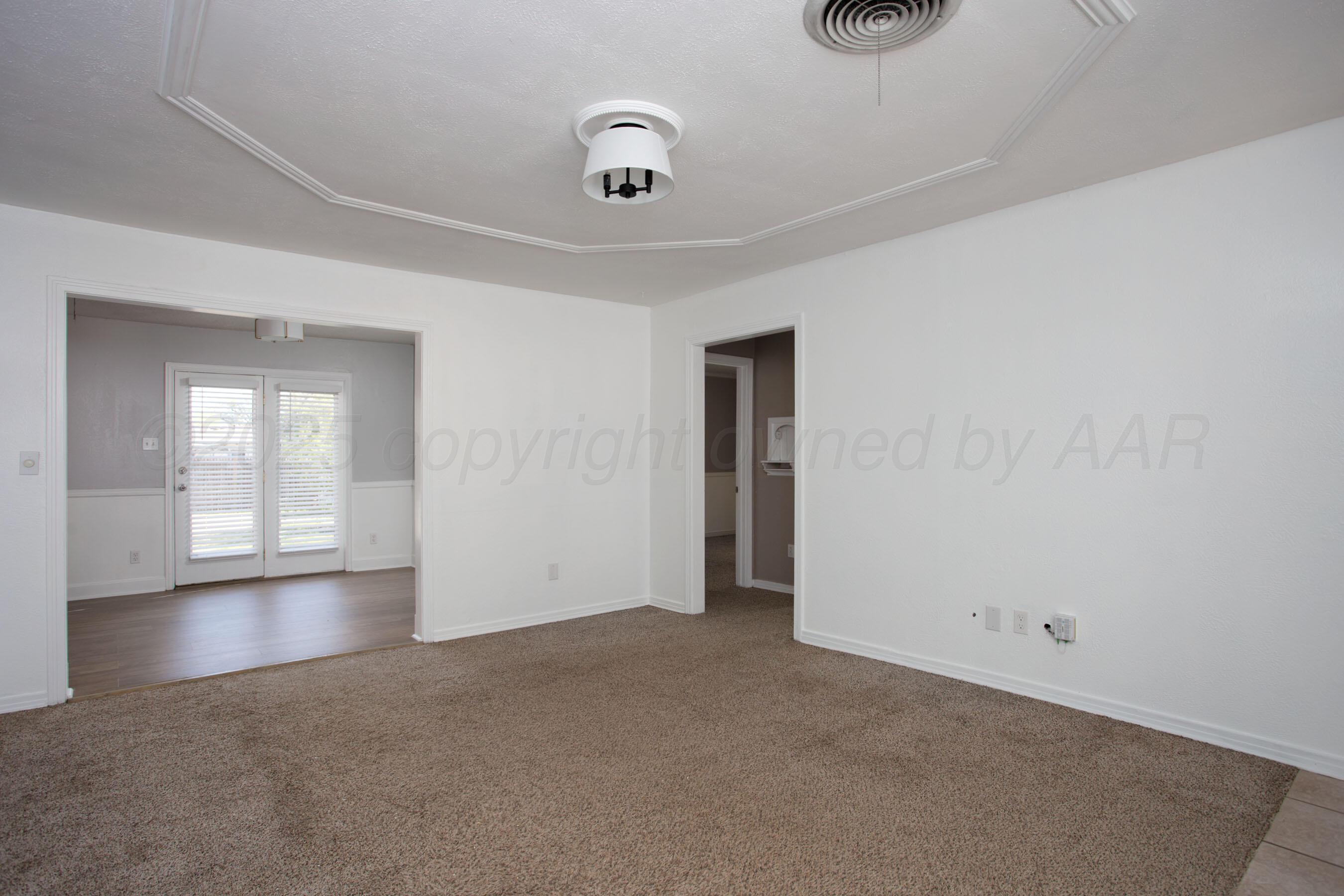 4215 South Travis Street Amarillo, TX 79110 - Photo 17 of 20 a view of an empty room and window