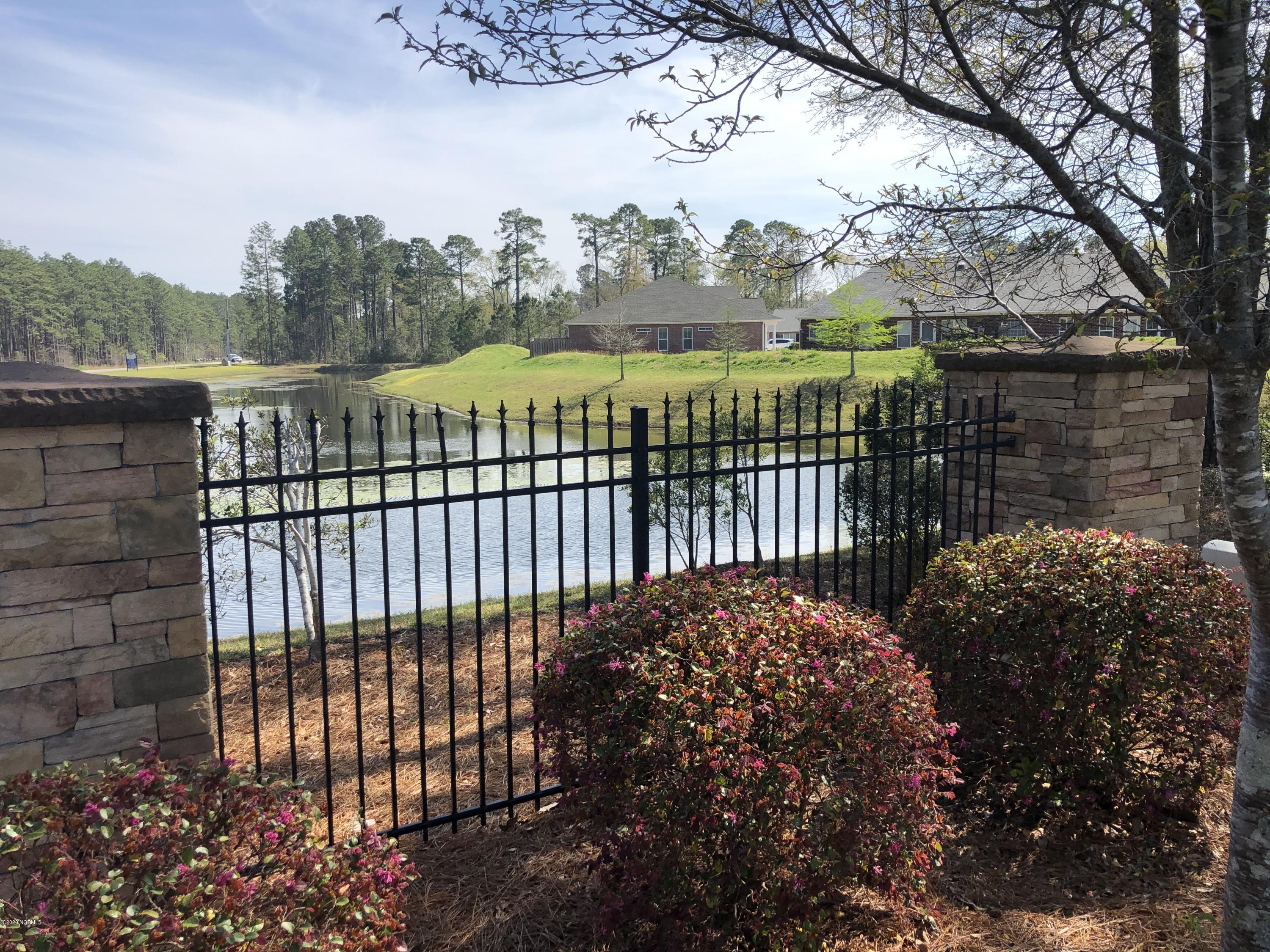 8045 Footpath Road Leland, NC 28451 - Photo 43 of 45 Tranquil entry, Wooden Bridges, Community Ponds...what a great "Welcome Home"!