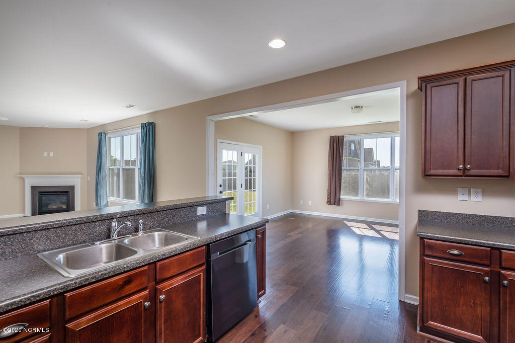 8045 Footpath Road Leland, NC 28451 - Photo 9 of 45 Sunroom off of the Living Room and Kitchen; Open Concept Living