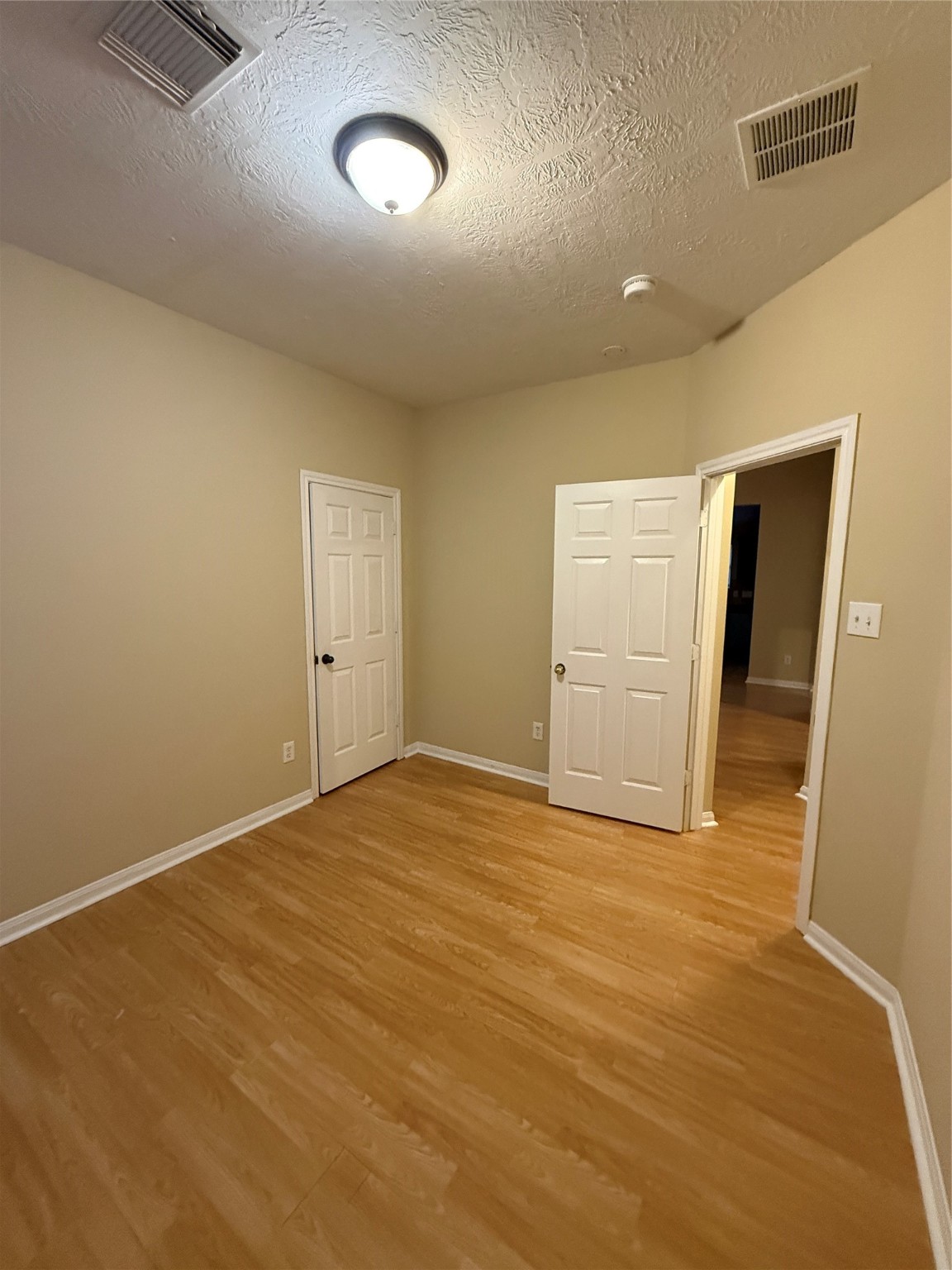 22031 Falvel Drive Spring, TX 77389 - Photo 13 of 21 a view of an empty room with wooden floor