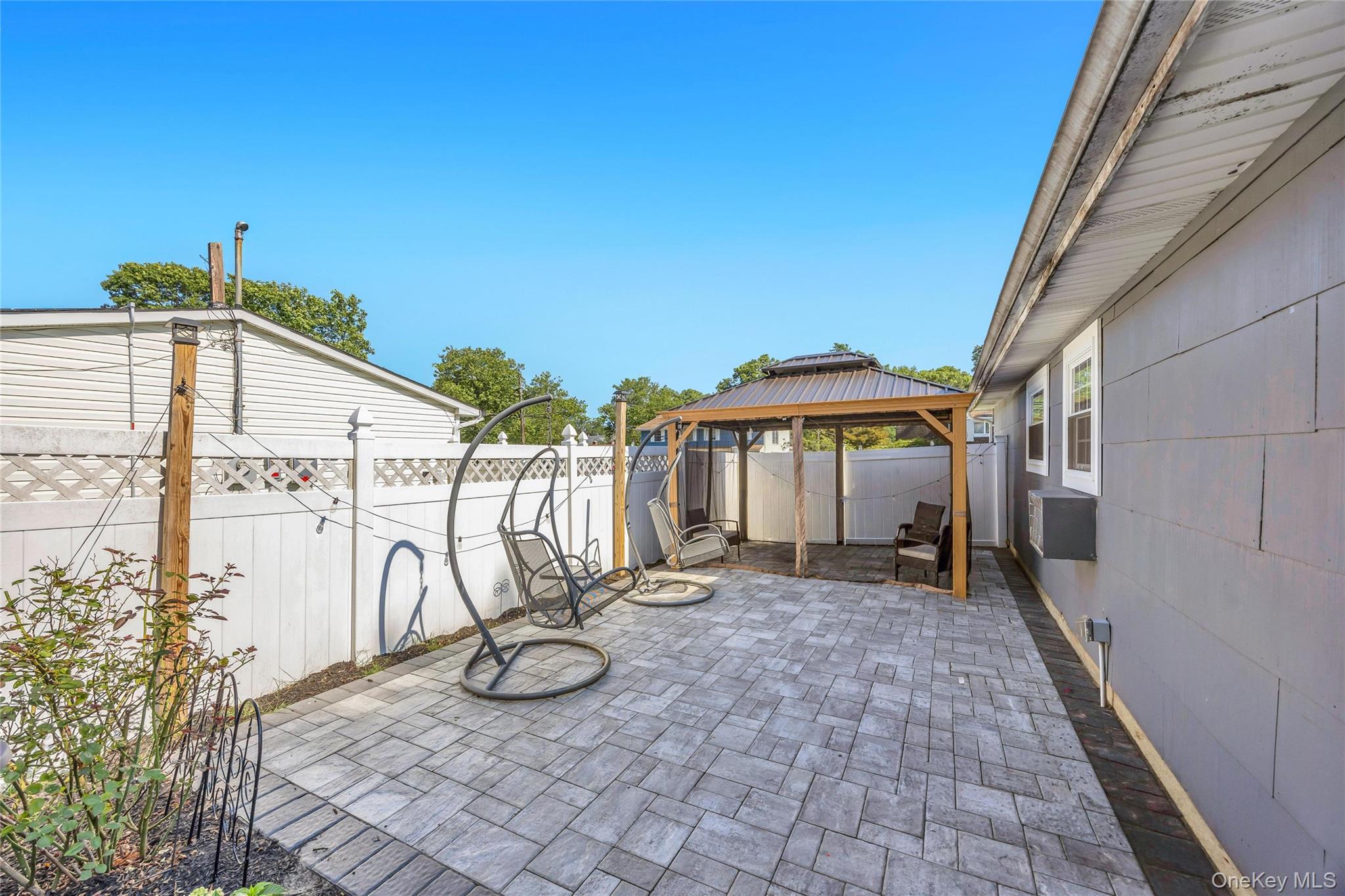 7 Amherst Road Ronkonkoma, NY 11779 - Photo 8 of 36 a view of a house with backyard and sitting area