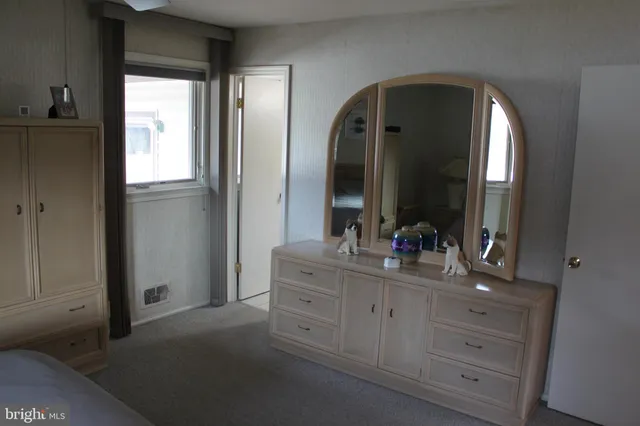 a en suite bathroom with a double vanity sink and a mirror