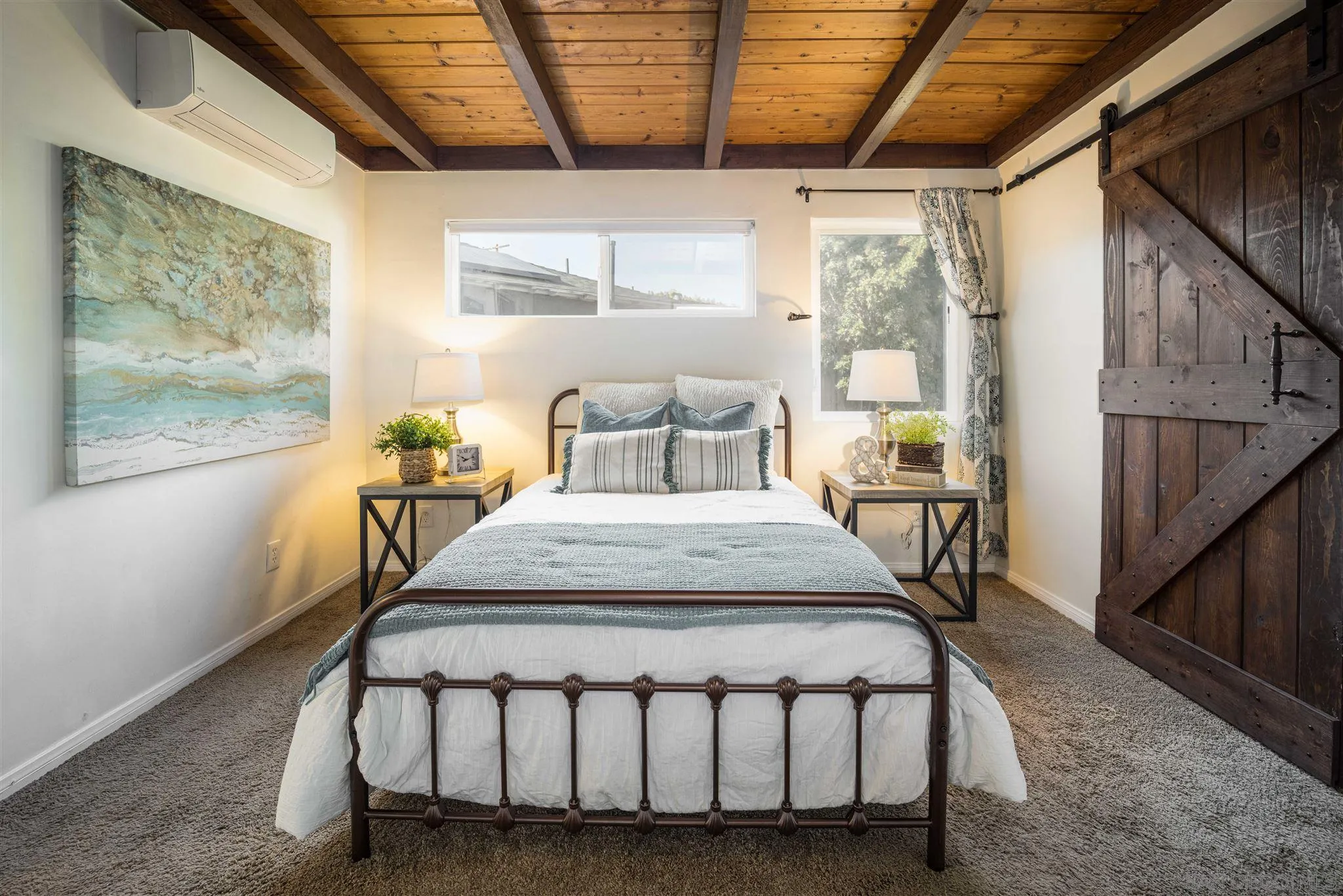962 Wilfred Street El Cajon, CA 92021 - Photo 11 of 27 a bedroom with a bed a table and windows