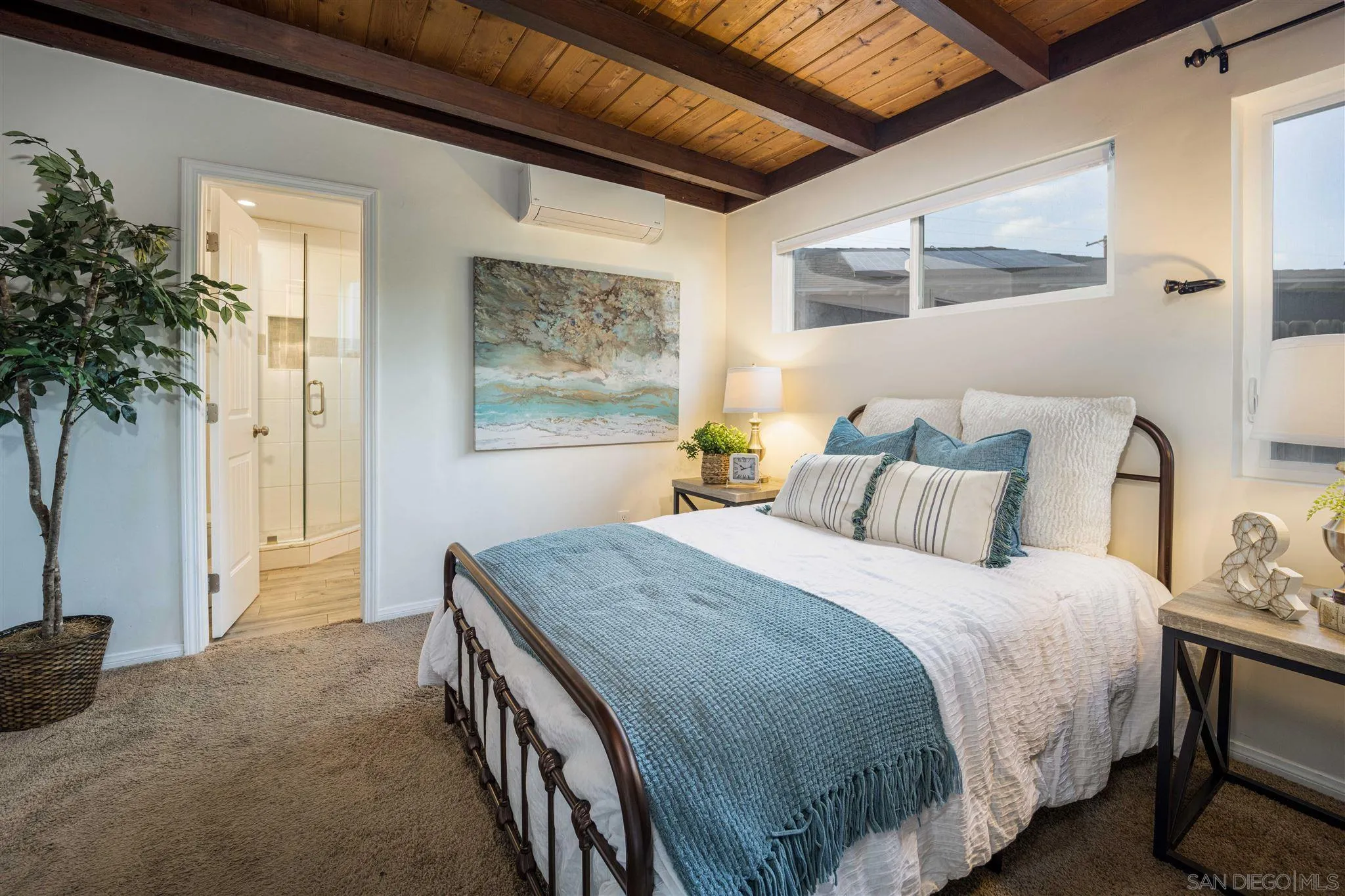 962 Wilfred Street El Cajon, CA 92021 - Photo 14 of 27 a bedroom with a bed and a potted plant