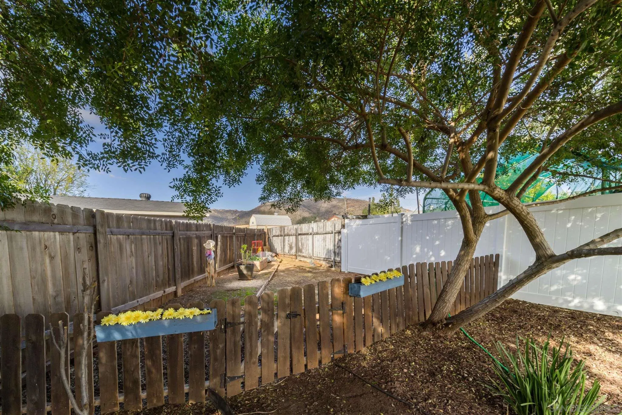 962 Wilfred Street El Cajon, CA 92021 - Photo 26 of 27 a view of a bench in a backyard