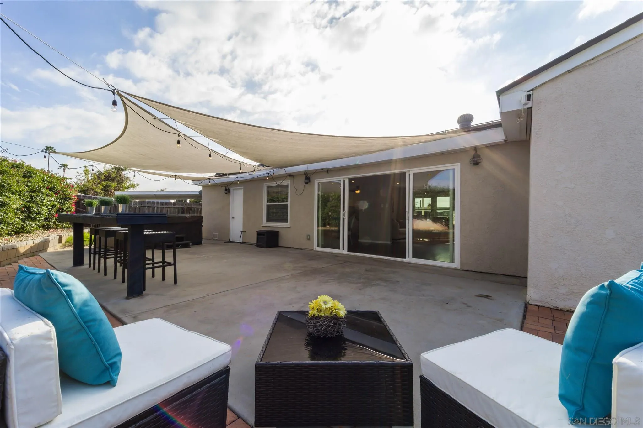 962 Wilfred Street El Cajon, CA 92021 - Photo 3 of 27 a dinning table and chairs in patio of the house