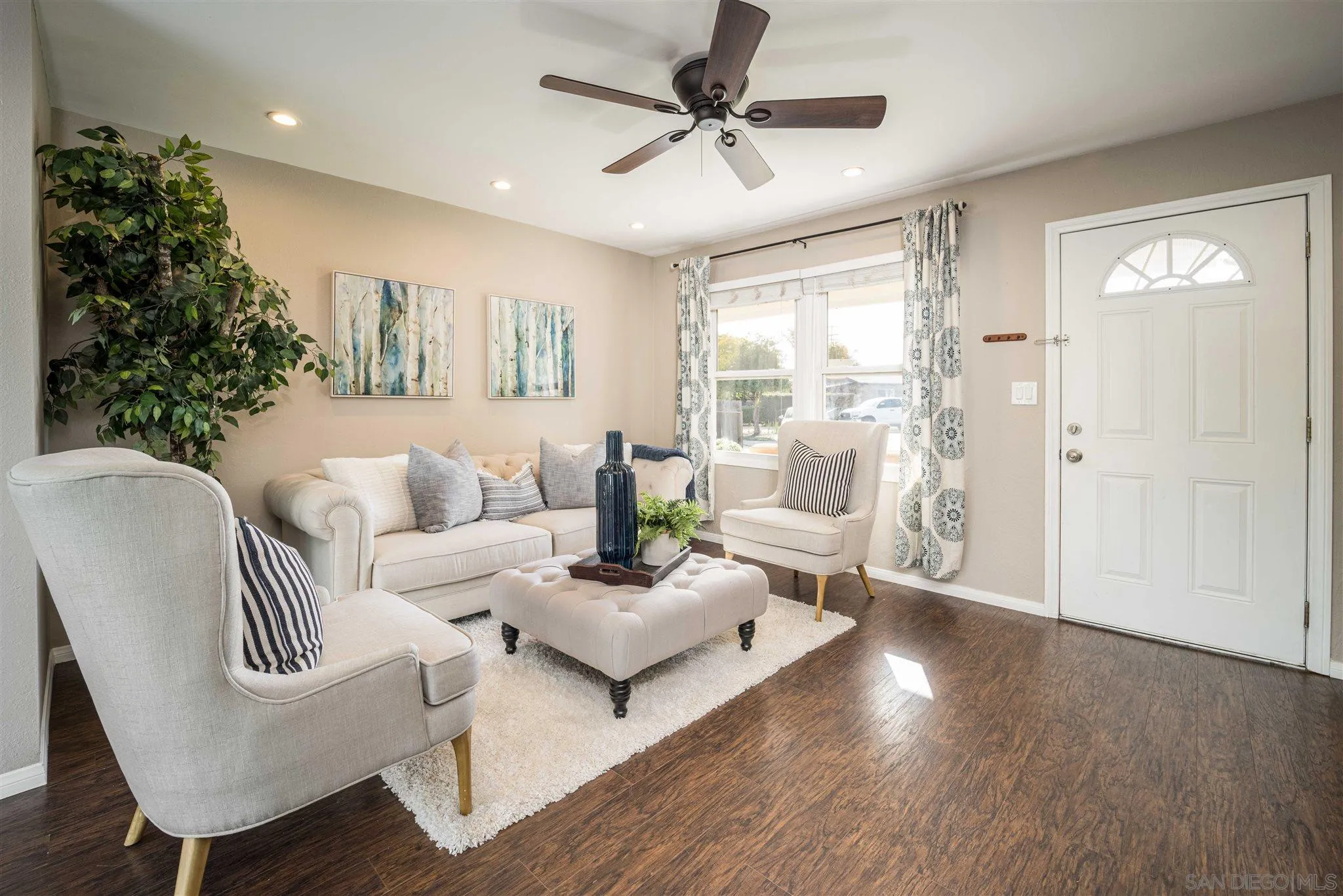 962 Wilfred Street El Cajon, CA 92021 - Photo 7 of 27 a living room with furniture and a large window