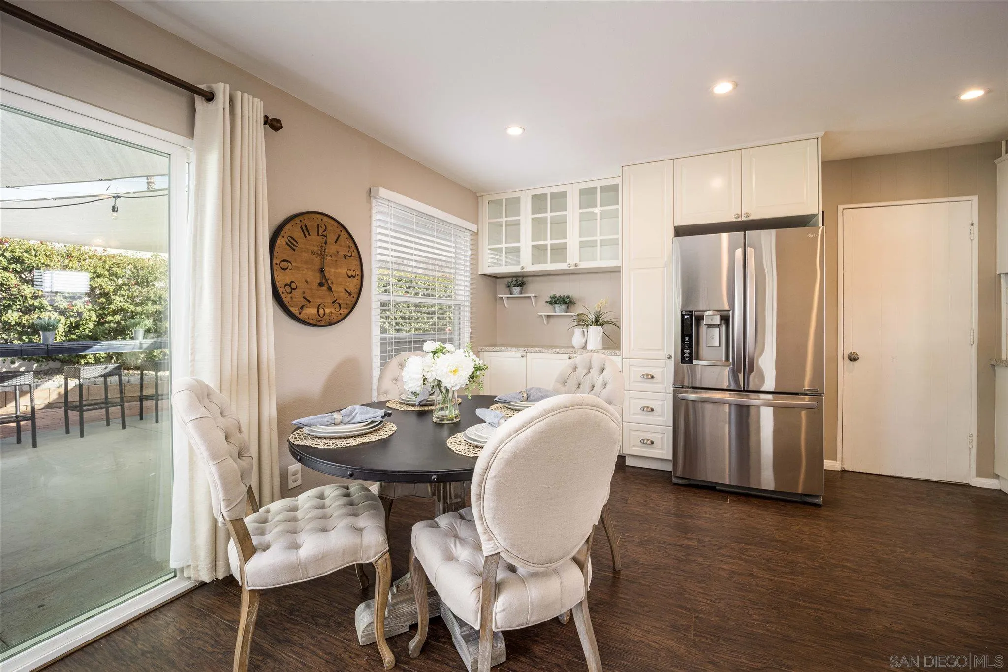 962 Wilfred Street El Cajon, CA 92021 - Photo 10 of 27 a dining room with furniture and a clock