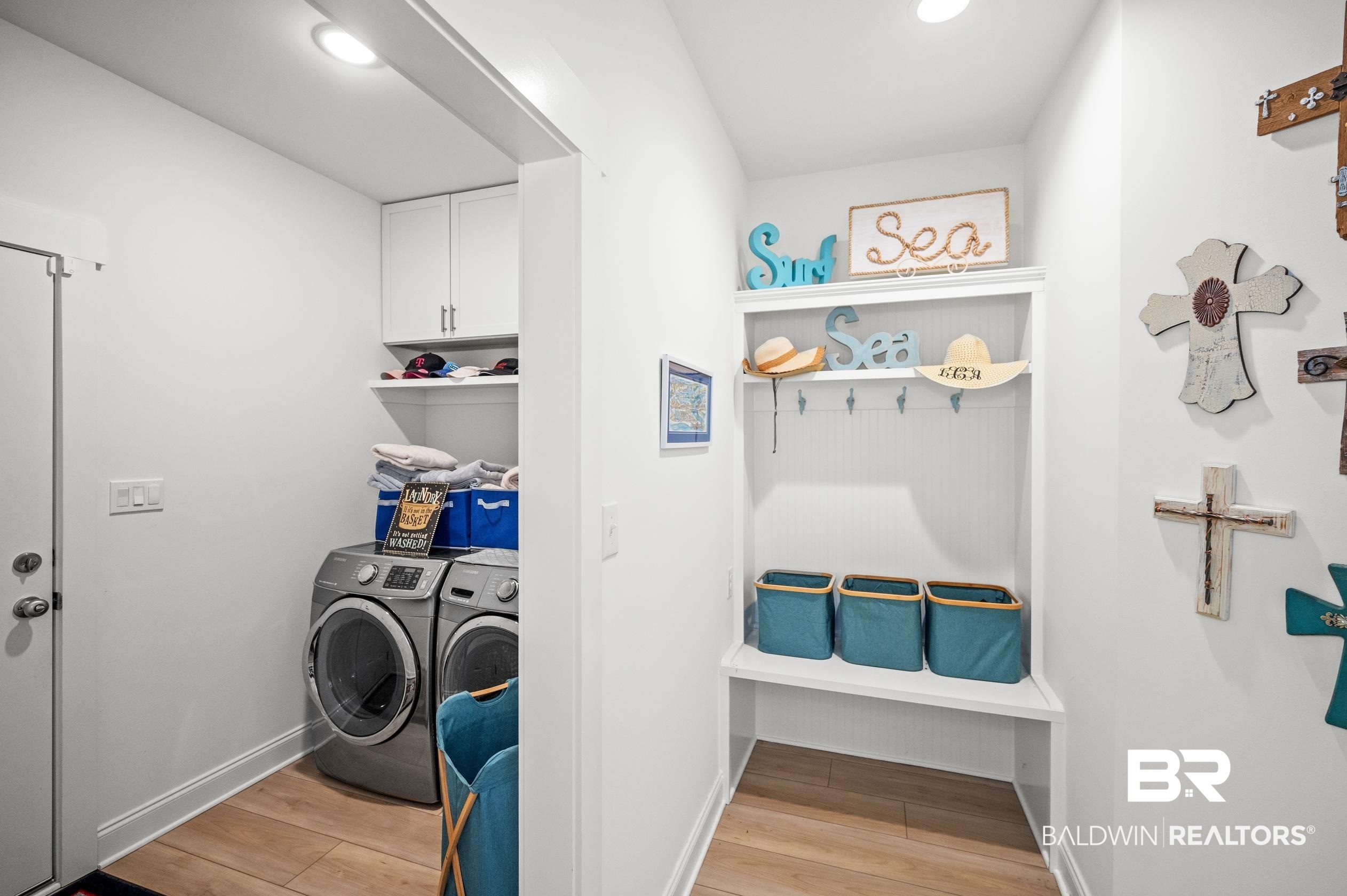 4601 Surrey Lane Orange Beach, AL 36561 - Photo 33 of 43 Clothes washing area with independent washer and dryer and light hardwood / wood-style floors