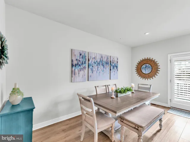 a bathroom with a sink toilet a mirror and shower