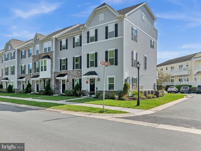 a view of a big building next to a yard