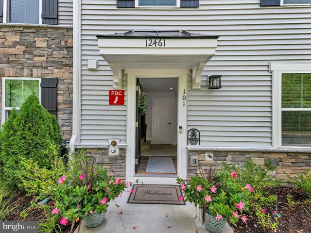a front view of a house with a garage