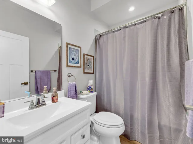 a room with pool table and windows