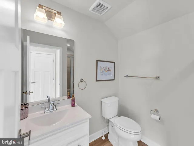 a view of a park with large trees