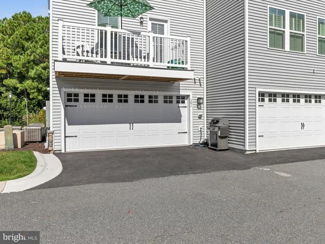 a view of a house with a swimming pool and a porch