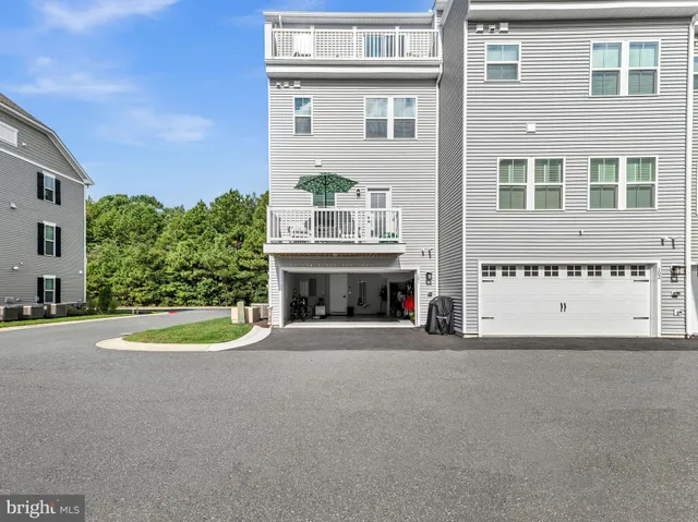 a view of a balcony with wooden floor and city view
