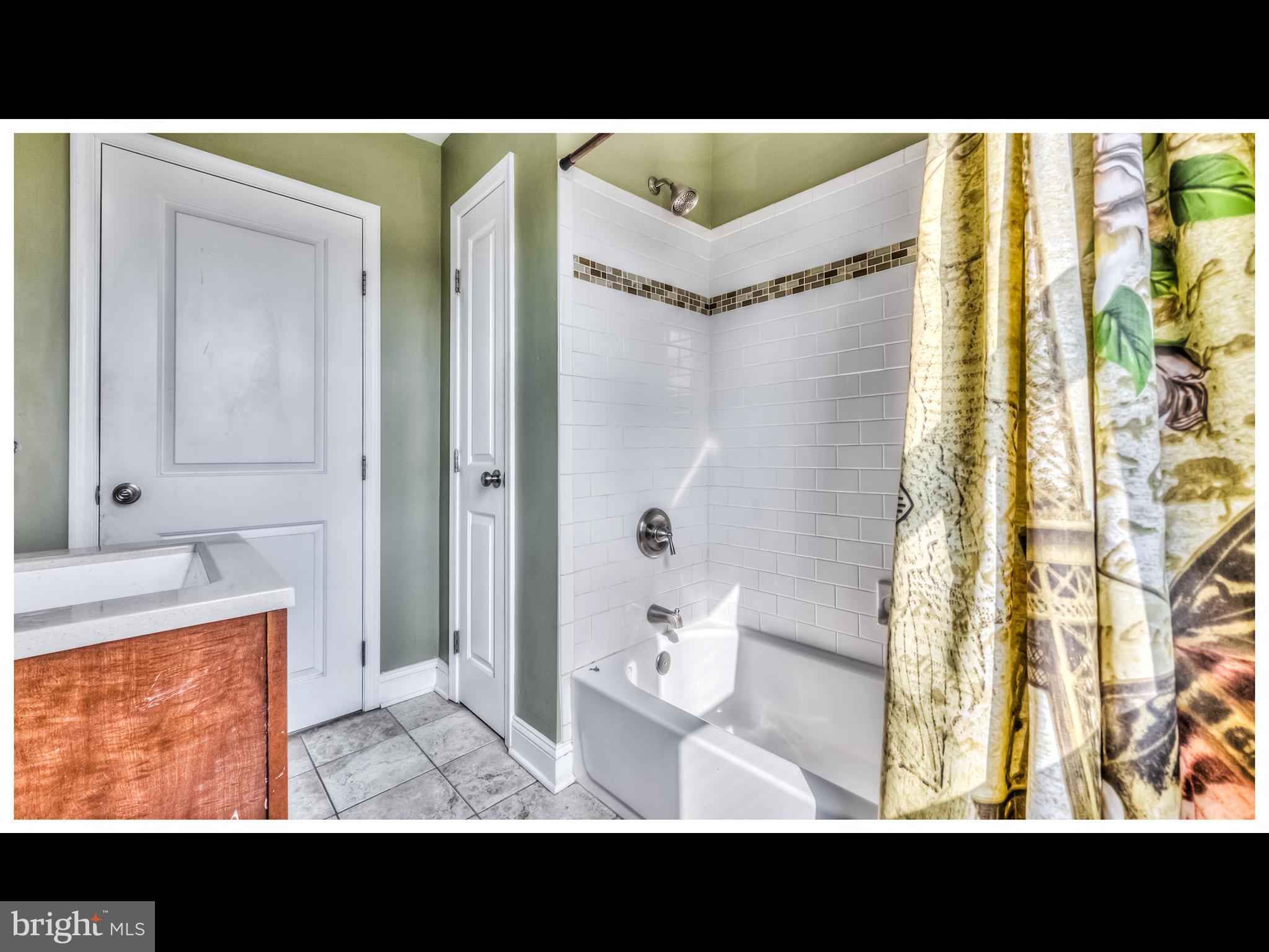 836 Bradhurst Road Baltimore, MD 21212 - Photo 15 of 24 a view of bathroom with a sink and mirror