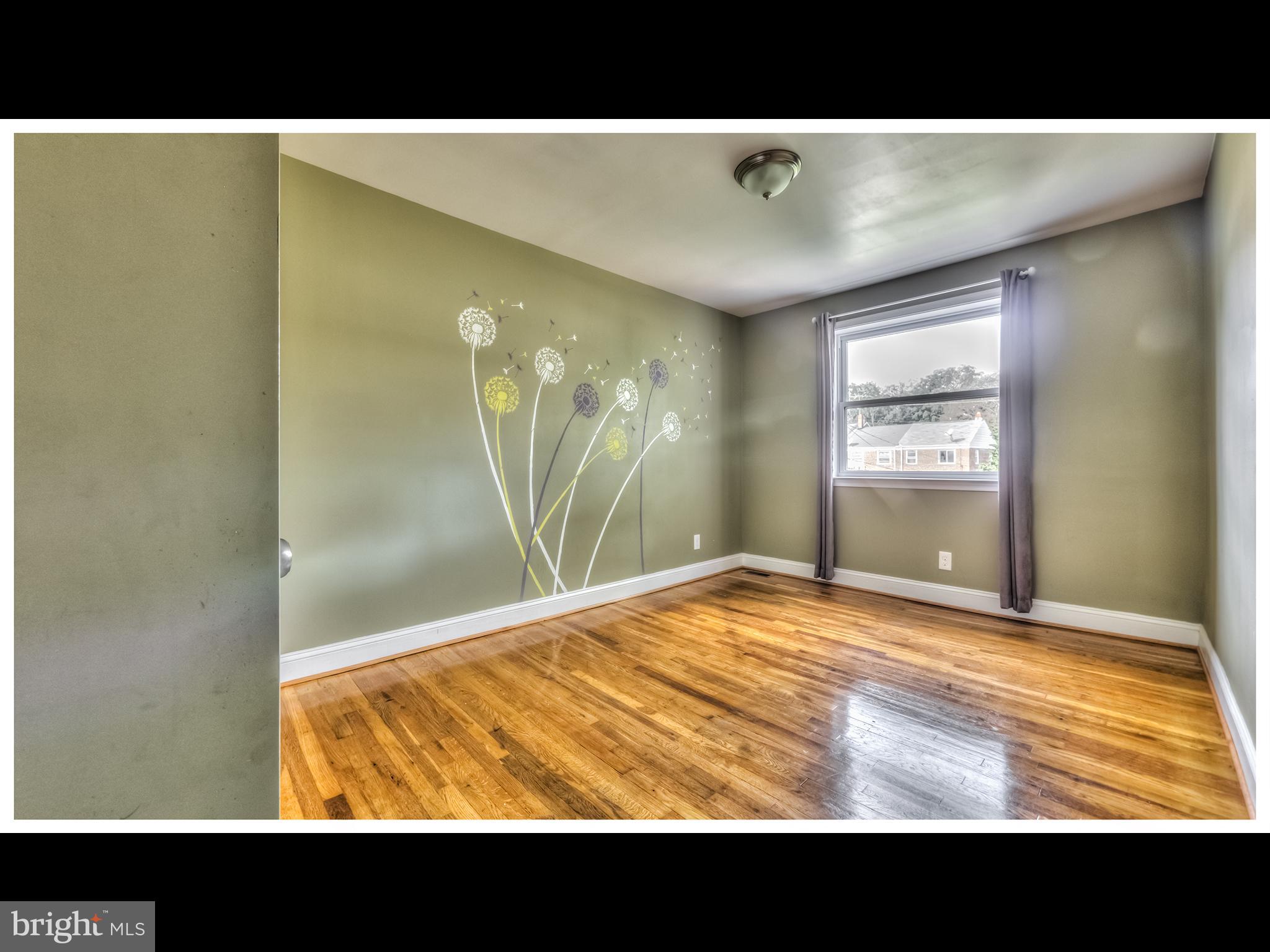 836 Bradhurst Road Baltimore, MD 21212 - Photo 18 of 24 a view of an empty room with window and mirror