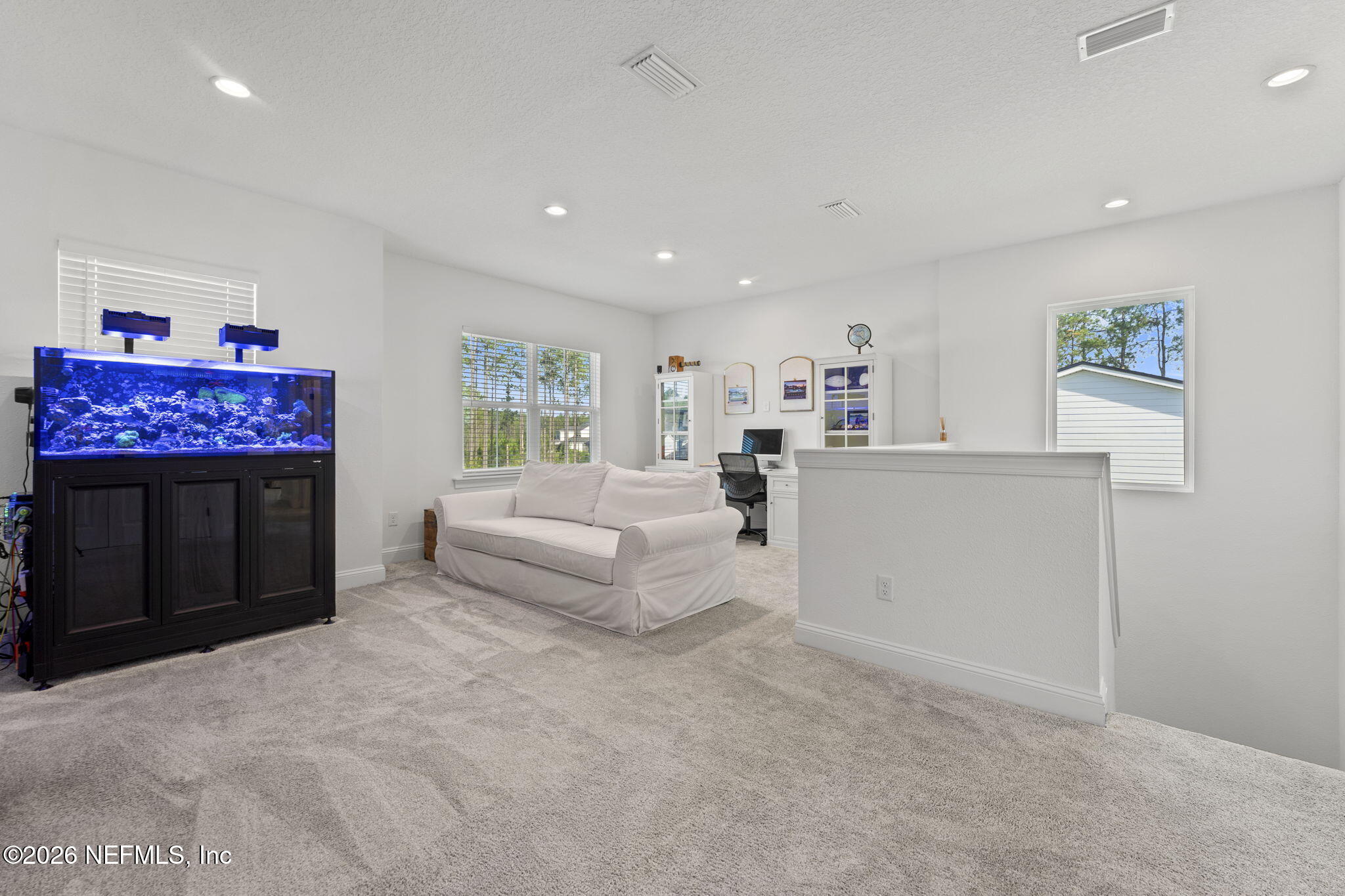 101 Elm Br Road St. Johns, FL 32259 - Photo 34 of 77 a living room with furniture and a flat screen tv