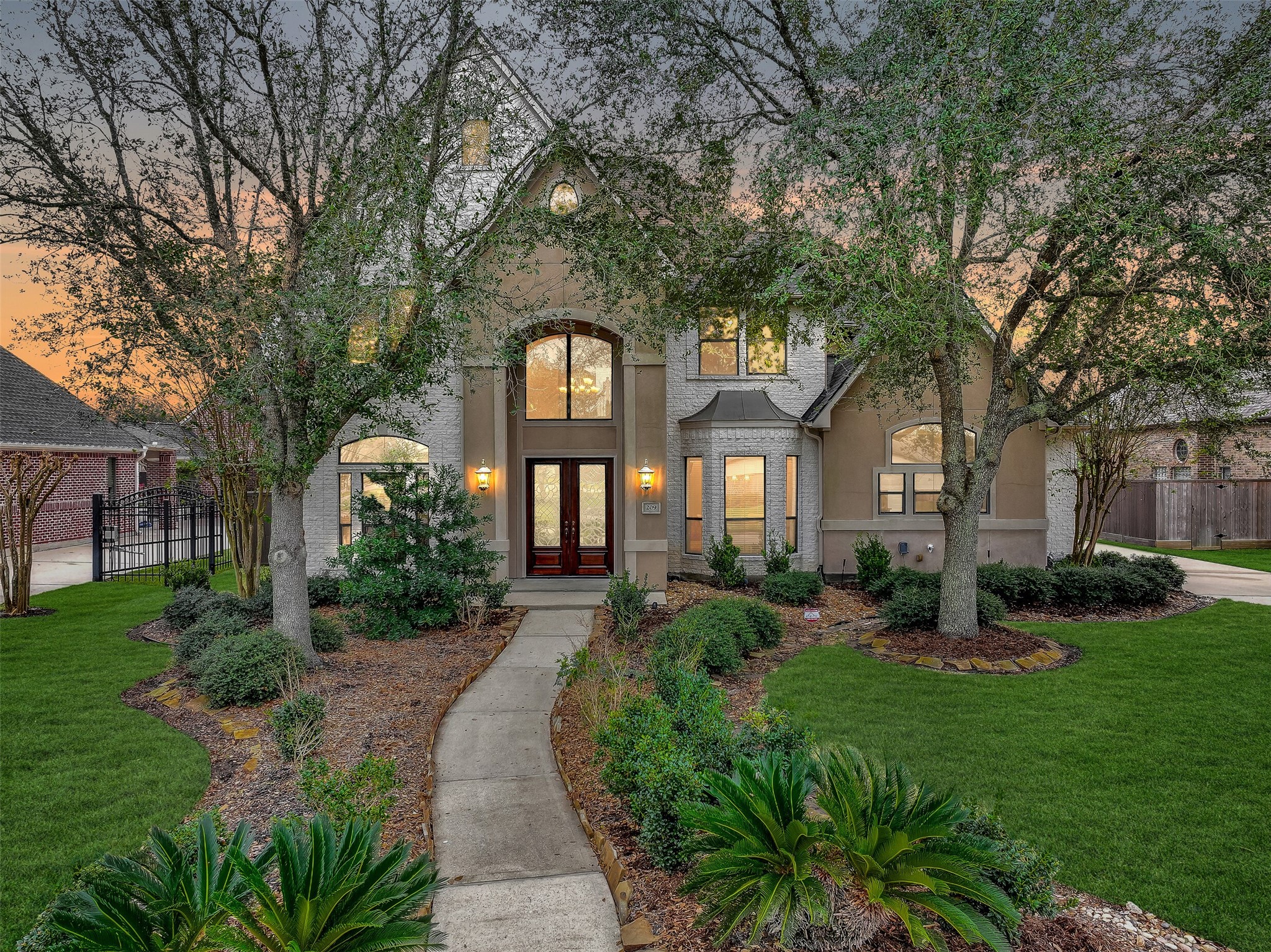 a front view of a house with garden